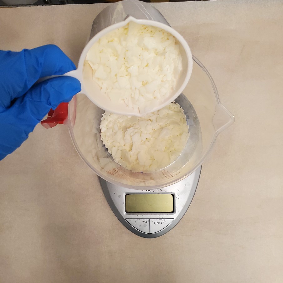 weighing wax for ice cream candles