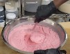 stirring lumps out of cooled wax